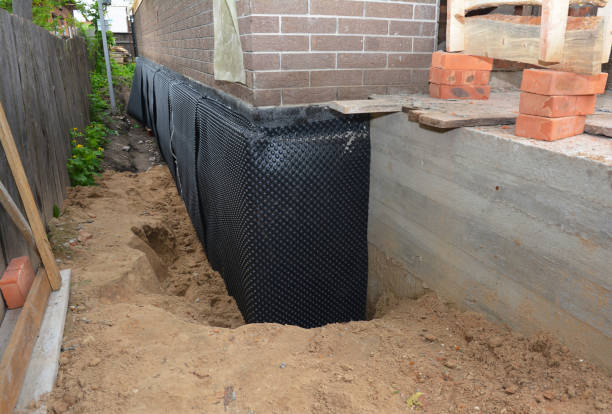 SJ Waterproofing Pros technician performing targeted Exterior Waterproofing assessment in Kingston, TN
